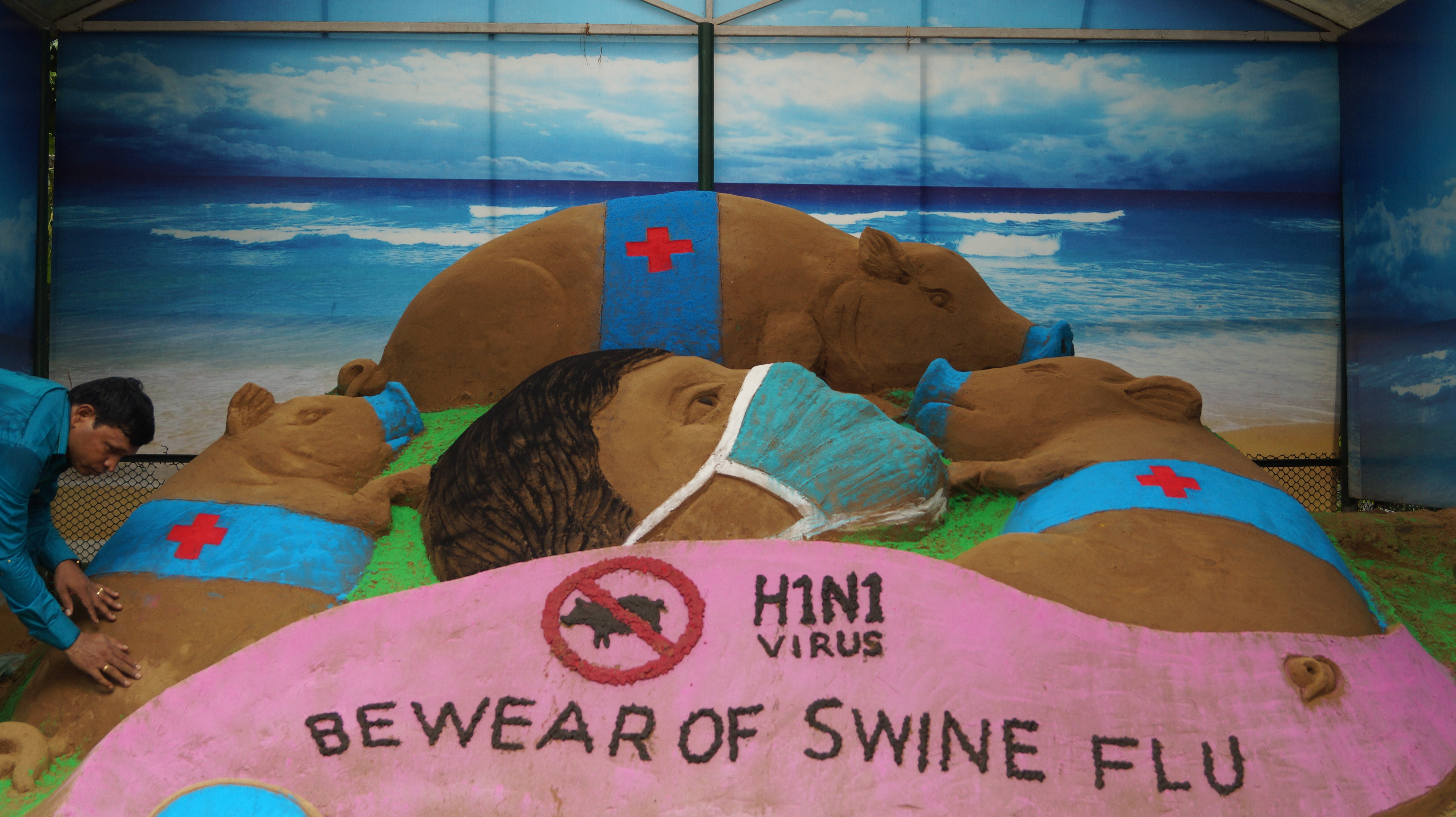 Sand art by Subala Maharana to spread awareness on swine flu