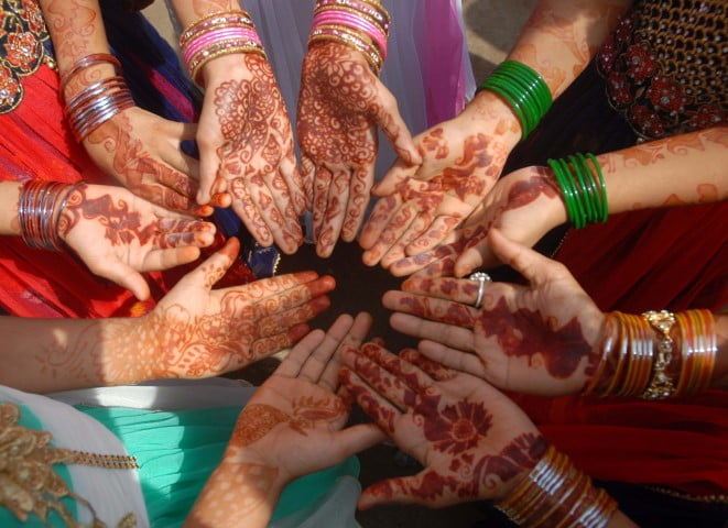 Muslim girls make mehendi on the occassion of Eid in Bhubaneswar on thursday.