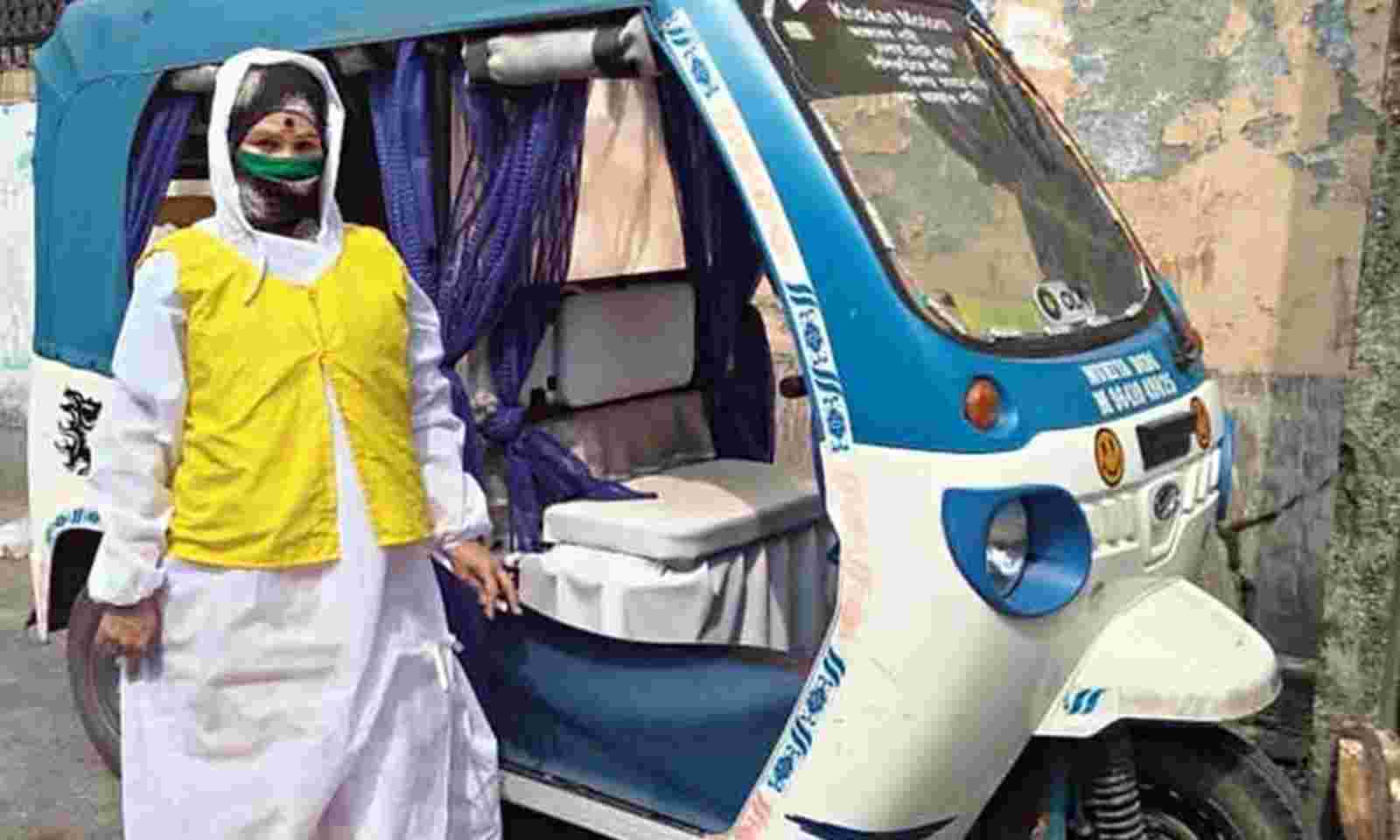 female e-rickshaw driver