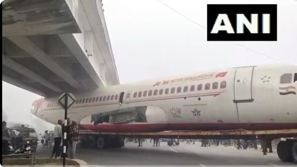 plane stuck under bridge